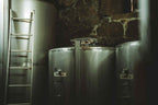 Stainless steel tanks and ladders in the bodega cellar